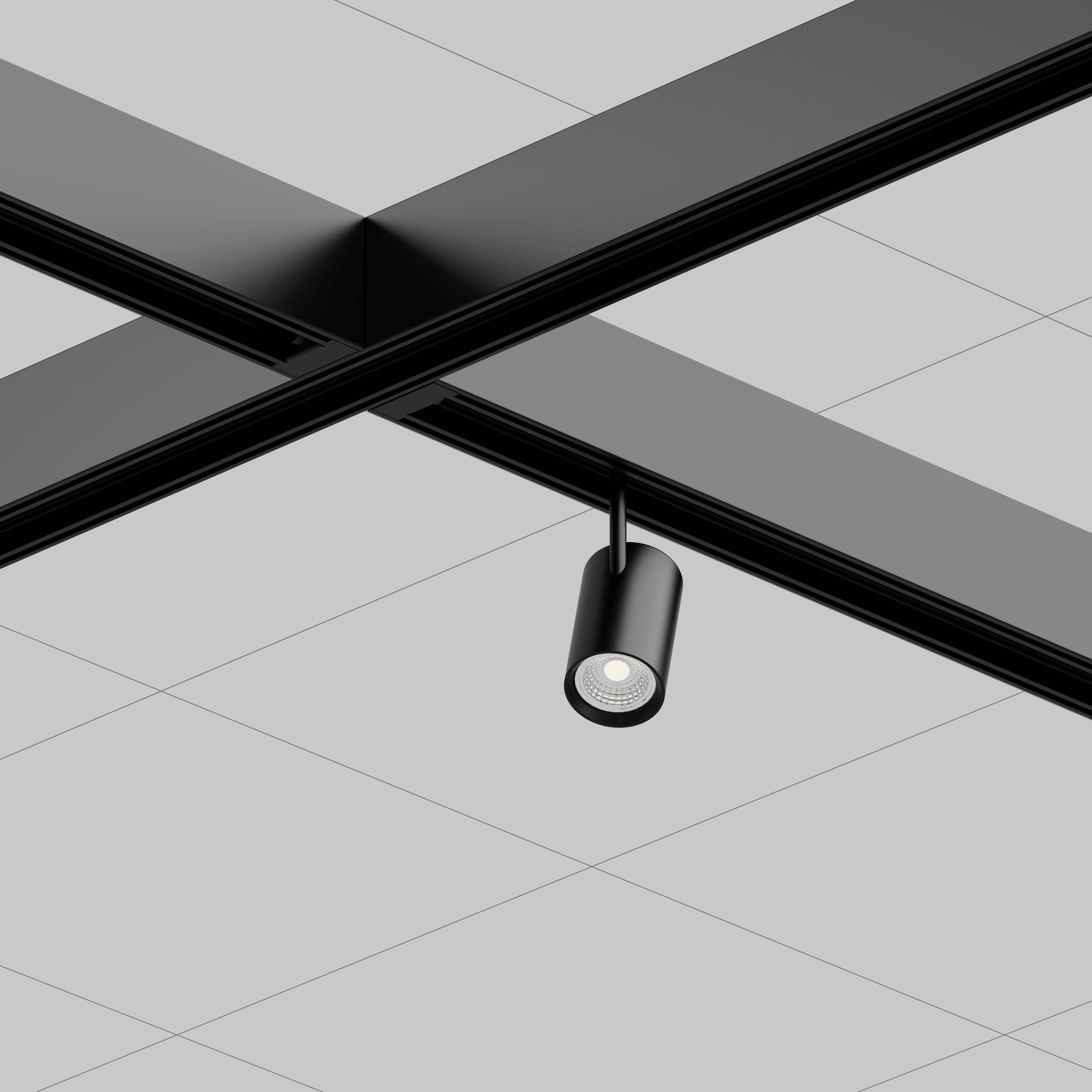 Structure m&eacute;tallique noire au plafond avec un spot cylindrique orient&eacute; vers le bas.